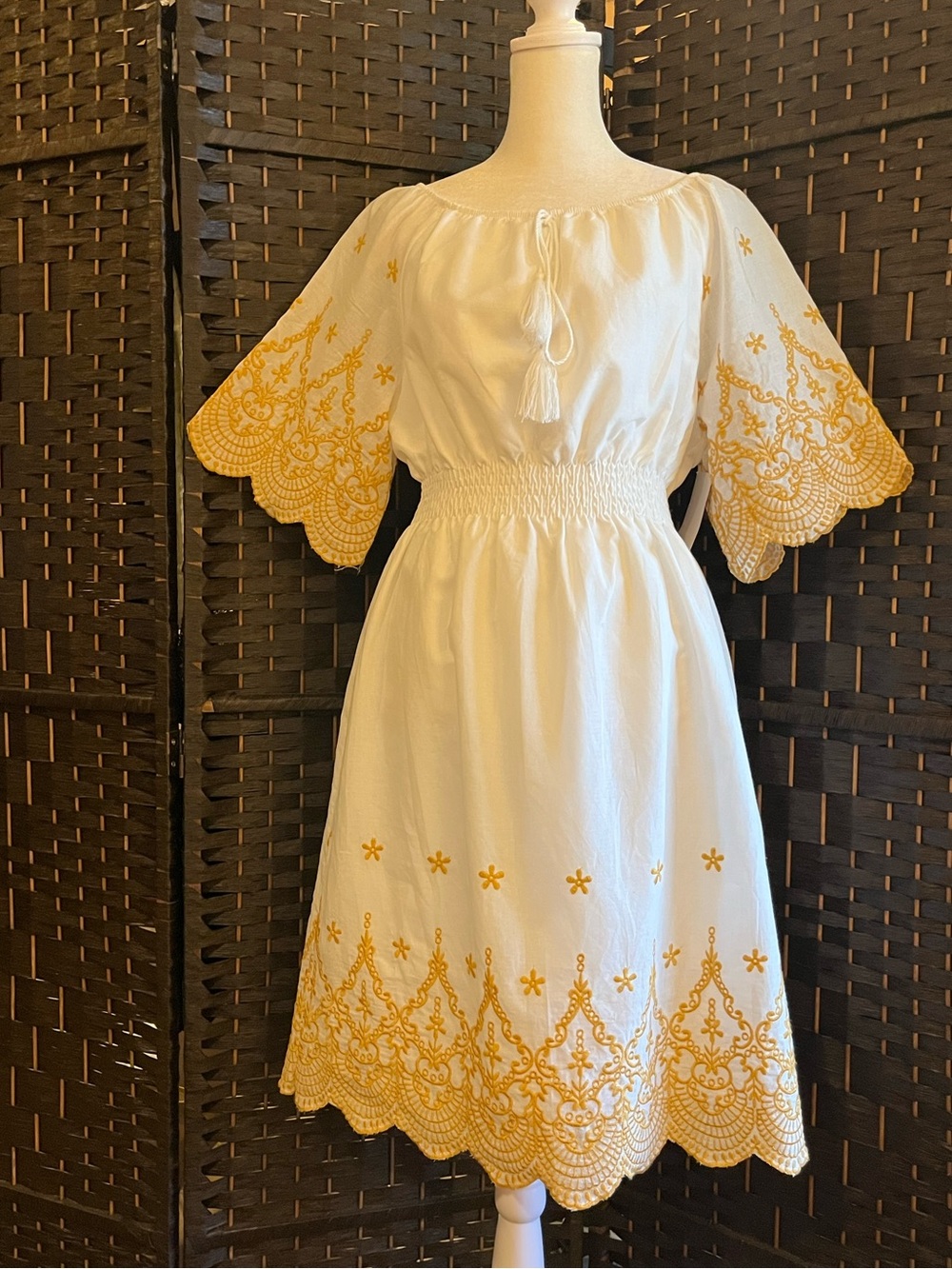 Kindred Embroidered Peasant Dress. Smocked-Waist. 100% cotton. White, gold. M-L